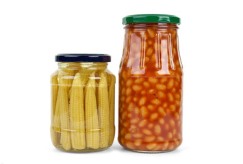 Glass jars with marinated corn ears and harricot beans
