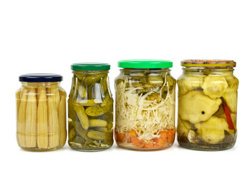 Glass jars with marinated vegetables