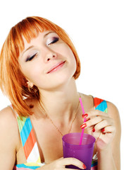 Beautiful red girl with glass of soda
