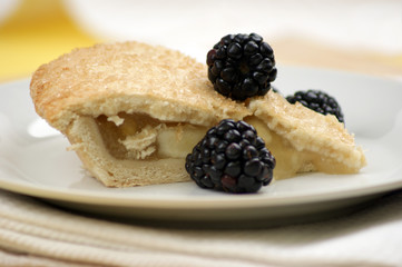 home made bramley apple pie with blackberries