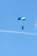 Fototapeta na wymiar Extreme sports. parachuting under a blue sky