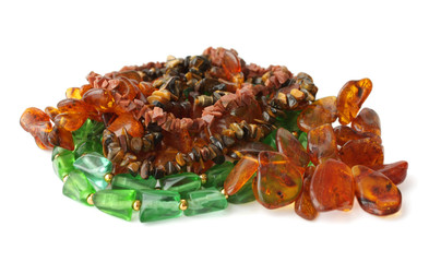 Different colored beads on a white background