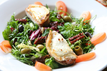 Italian salad with cheese on toasted bread