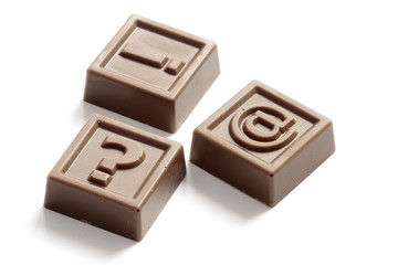 Question mark, exclamation point and at made of chocolate