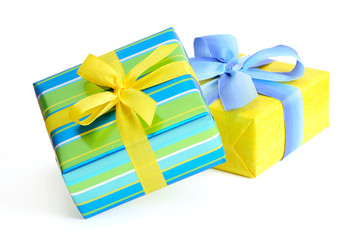 Gift boxes with ribbons and bows on white background