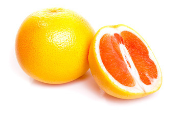 Red grapefruits on the white background