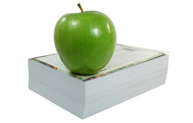 Apfel auf Buch