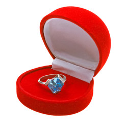 Silver ring with topaz in red box. Isolated on white