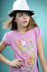 child showing two hats