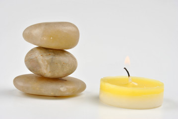 Fototapeta na wymiar three stone and a candle makes calm