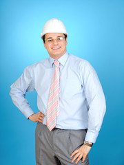 An engineer with white hard hat on blue background