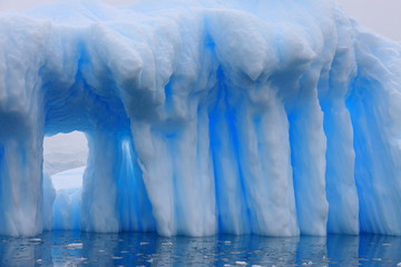 Iceberg with window in Antarctica
