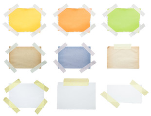 Collection of papers taped to white
