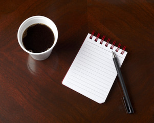 cup of coffee drink notebook pencil business