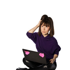young woman with laptop is thinking