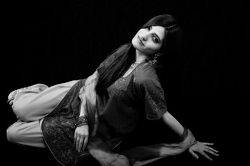 lovely woman reclining on the floor in black and white