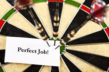 Cut image of dart pierced on target over dartboard