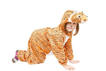 little girl wearing tiger costume isolated on white