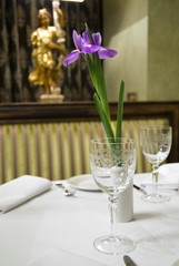 served table in restaurant with flower