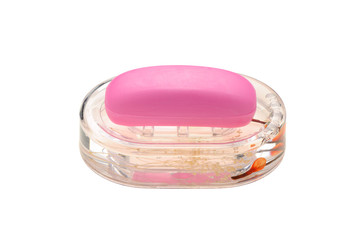 Soap of pink color in a transparent soap tray