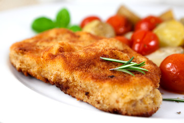 Schnitzel with baked vegetables and rosemary