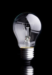 Photo of light bulb on black background.