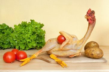 full length chicken lying on cutting board © Stéphane Bidouze