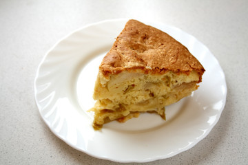 Apple pie piece on the white plate