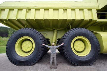 Earth moving dump truck with a man at the wheel