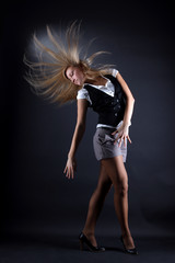 woman modern dancer against black background