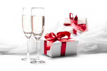 Gift decorated with bow, glass wine