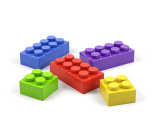 Plastic toy blocks on white background.