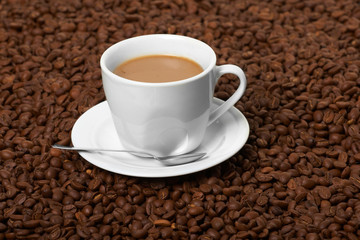 Cup with coffee, costing on coffee grain