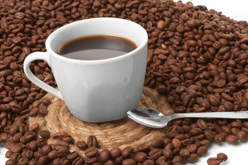Cup with coffee, costing on coffee grain