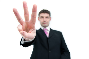 Businessman Holding Up Three Fingers