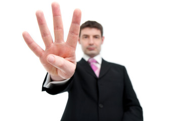 Businessman Holding Up Four Fingers