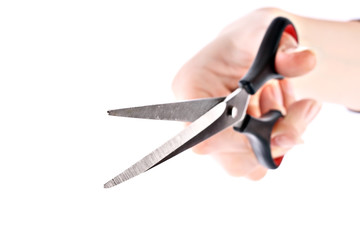 Scissors in hand isolated on white background.