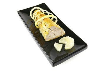 roast tuna with lemon on ceramic plate