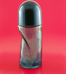 Glass for deodorant on pink background