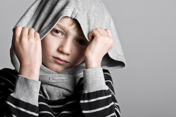 Boy Hiding his Face in Hooded Top