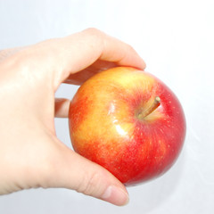 Hand und Apfel