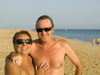 Fototapeta premium Senior Couple having fun in the beach