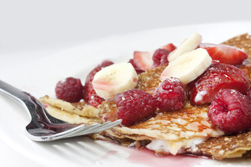 raspberry and strawberry crepes or pancakes
