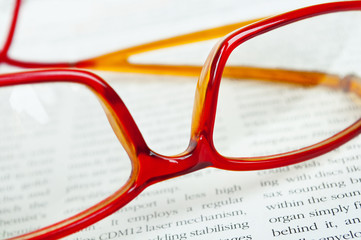 Reading glasses on book