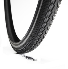 bicycle tire with a skidmark on white background