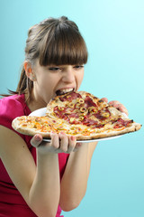 hungry girl eating pizza