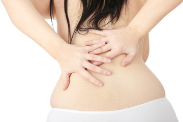 Nude woman with back pain