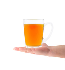 Glass cup of tea in hand isolated on white