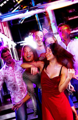 Young adults at a nightclub dancing