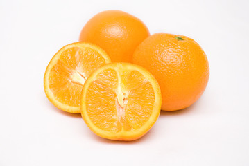 Orange fruits cut into two pieces
